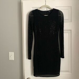 Black dress. Size medium. Sheer dress and sleeves- lined with black dress liner.